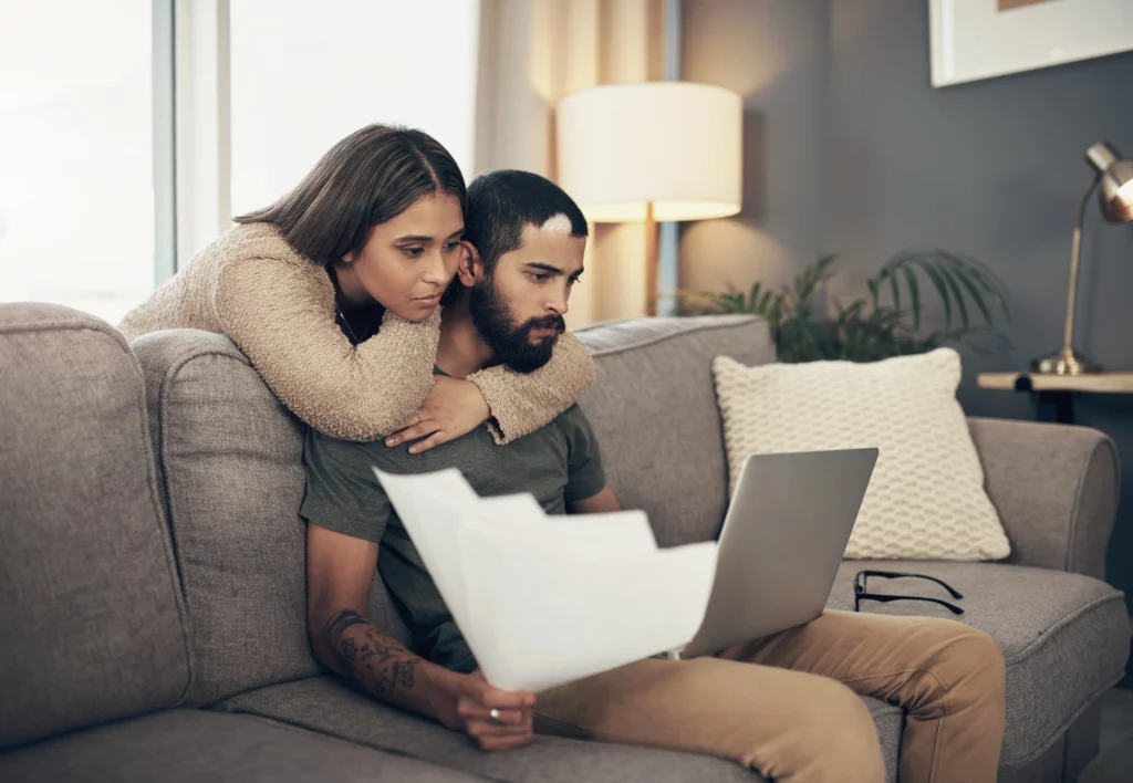 Home V2 18 Couple reviewing marriage green card and work authorization documents together on a laptop at home
